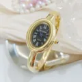 Gold oval bangle quartz watch for women with black Roman numeral dial elegant jewelry style - Regular Fit / Black