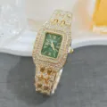 Detailed view of luxury gold rhinestone quartz watch with green dial and paved crystal band. - Gold and Green