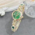 Elegant women's rhinestone quartz watch with green dial and gold-tone chain bracelet detail. - Green