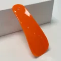 Orange plastic shoehorn variant, portable hanging shoe helper for easy wear, smooth design. - Orange