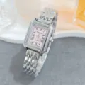 Detailed shot of a silver rectangular quartz watch with a pink dial and Roman numerals. - Silver Pink