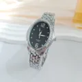 Modische Damen Oval Quarz Uhr mit Strass Lünette und silbernem Stahlarmband für den Alltag. - Silber Schwarz