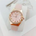 Élégante montre quartz femme rose avec lunette strass et boîtier or rose pour le quotidien. - Rose