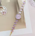 Elegante Damen Quarzarmbanduhr mit lila Zifferblatt und funkelnden Kristallstein Armband. - Lila