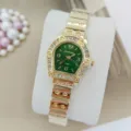 Montre à quartz dorée pour femme avec cadran vert, lunette en strass et bracelet en acier. - Vert
