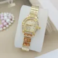 Elegant gold-tone women quartz watch with sparkling rhinestones and unique screw design. - Gold