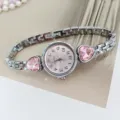 Elegant women quartz watch featuring pink heart crystal charms and silver metal bracelet. - Silver Pink