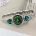 Detailed view of women quartz watch with green dial and heart crystal silver bracelet. - Silver Green