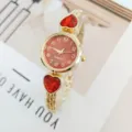 Elegant women quartz watch featuring red heart crystal charms and gold metal bracelet. - Gold Red