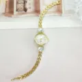 Women's gold-tone quartz watch featuring elegant heart rhinestone accents and linked metal band. - Gold White