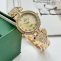 Reloj de cuarzo dorado para mujer con diamantes de imitación, diseño de pulsera de corazón. - Dorado