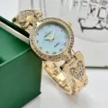 Reloj de cuarzo dorado elegante para mujer con brillantes y diseño de corazón chic. - Azul flujo dorado