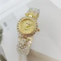 Gold rhinestone women quartz watch detail shot featuring crystal bezel and crystal bracelet band. - Gold
