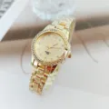 Gold rhinestone quartz women watch detail view, elegant metal strap and sparkly dial. - Gold