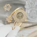Élégante montre bracelet quartz femme fleur strass dorée luxe mode accessoire chic. - Or Noir