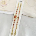 Elegantes Damen Quarzarmbanduhr und passendes Armband Set mit roten Strasssteinen geschmückt. - Rot