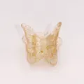 Close-up of a cute glitter butterfly hair claw clip in jelly gold color, detail feature. - 2.0cm / Yellow