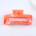 Square acrylic hair claw clip with orange marble pattern, stylish retro for daily hair. - Orange