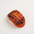 Retro oval hair claw clip in stylish tortoiseshell pattern, premium plastic hair accessory for women. - Matte Amber Red