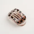 Classic oval hair claw clip with stylish tortoise shell pattern, elegant hair accessory for women. - Glossy Transparent Amber White