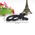 Black plastic banana hair clip with butterfly shape for daily styling and secure hair hold. - Bow Banana Clip (T1536) / 10.8cm / Black