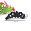 Black plastic banana hair clip with elegant flower design, 10.7cm length, perfect for styling. - Floral Banana Clip (T1645)