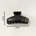 Black plastic hair claw clip detail close-up shot, minimalist daily hair styling accessory. - Hair Claw (Z1532) / 9cm / Bright Black