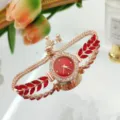Elegante reloj de cuarzo para mujer con pulsera cristal rojo y bisel de oro rosa. - Rojo
