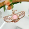 Exquisito reloj cuarzo oro rosa con esfera rosa y brillante pulsera cristal de hoja. - Rosa