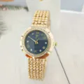 Elegant women's gold quartz watch with rhinestone bezel, blue dial and Roman numerals. - Gold Blue