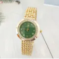 Detailed view of women gold quartz watch featuring green dial, rhinestone bezel and bead bracelet. - Gold Green