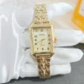 Elegante orologio da polso al quarzo da donna con quadrante quadrato e cinturino in acciaio. - Oro