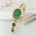 Detail view of luxury green oval dial quartz women watch with sparkling teardrop crystals. - Green