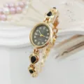 Elegant women's quartz bracelet watch with oval black dial, rhinestones and droplet stones. - Black