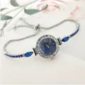 Montre quartz strass femme élégante avec détail de bracelet chaîne coulissante. - Bleu