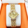 Orologio da polso donna al quarzo con quadrante trifoglio e strass brillanti, elegante design oro. - Oro
