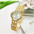 Vista dettagliata dell'orologio da donna al quarzo a trifoglio con strass dorati e quadrante. - Cassa Oro Quadrante Bianco