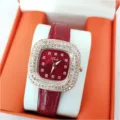 Close-up detail of women quartz watch featuring square rhinestone bezel and red leather strap. - Red