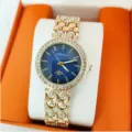 Montre bracelet quartz pour femme avec cadran bleu, lunette en strass et bracelet doré brillant. - Or Bleu