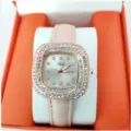 Detailed view of the square rhinestone women quartz watch with pink leather strap, elegant design. - Pink