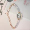 Detail shot of elegant women rhinestone square watch with golden chain bracelet and quartz movement. - Rose Gold White