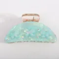 Molla per capelli in acrilico verde menta con grazioso design a fiocco e strass brillanti. - Verde