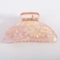 Molla per capelli in acrilico rosa con fiocchi carini e strass, elegante accessorio a mezzaluna. - Arancione