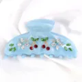 Molla per capelli in acetato azzurro con decorazioni di ciliegie farfalle in strass chic. - Azzurro