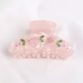 Molletta per capelli rosa in acrilico con foglie di strass verdi e cristalli rosa. - Rosa