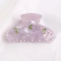 Elegante molletta per capelli in acrilico viola decorata con strass verdi e viola scintillanti. - Viola