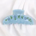 Molla per capelli in acetato azzurro con strass, design floreale elegante per ogni acconciatura. - Azzurro