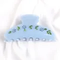 Molla per capelli azzurra in cristallo con strass floreali, accessorio elegante e chic. - Ciano Chiaro