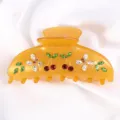 Molla per capelli in acetato color ambra con strass, motivo ciliegia e farfalla chic. - Ambra