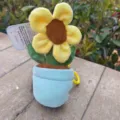 Cute sunflower potted plush pendant toy doll keychain, detailed view showing soft fabric. - Sunflower
